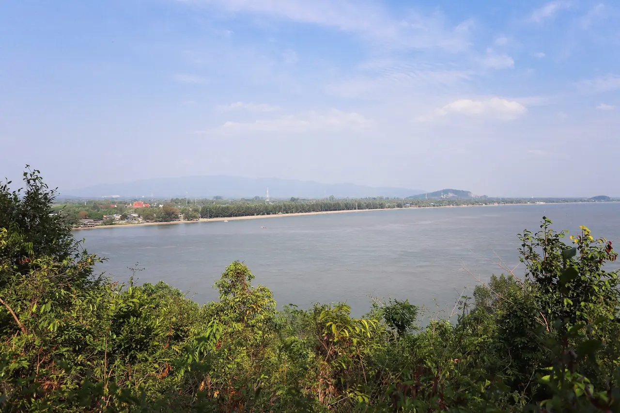 Laem Sing beach seen from Phairi Phinat Fort, with the long shoreline and the hills behind