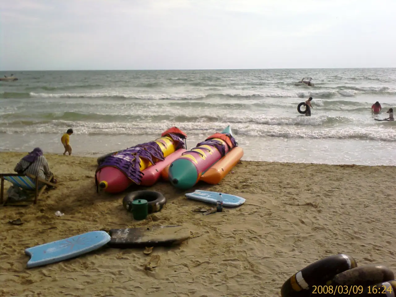 Banana-boat floats and swimmers on Chao Lao beach