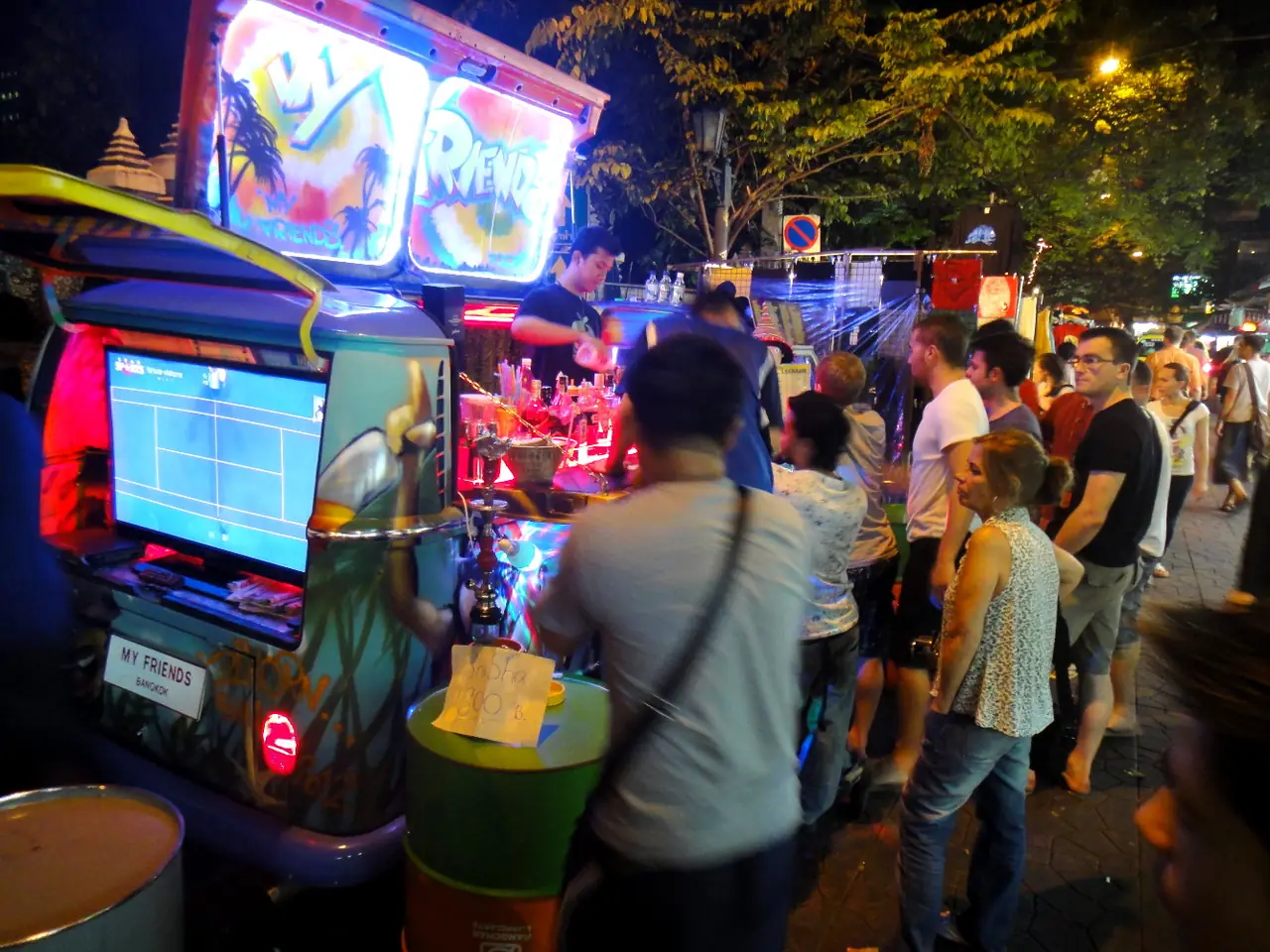 A bar truck in the evening crowd on Soi Rambuttri, Bangkok
