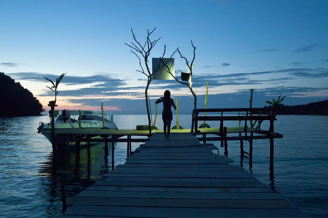 Bang Bao pier at twilight, with a boat moored beside it