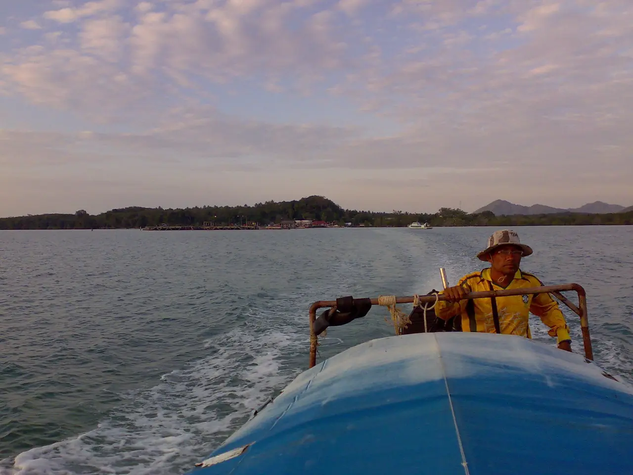 A longtail boat crossing the water between Koh Yao Noi and Koh Yao Yai
