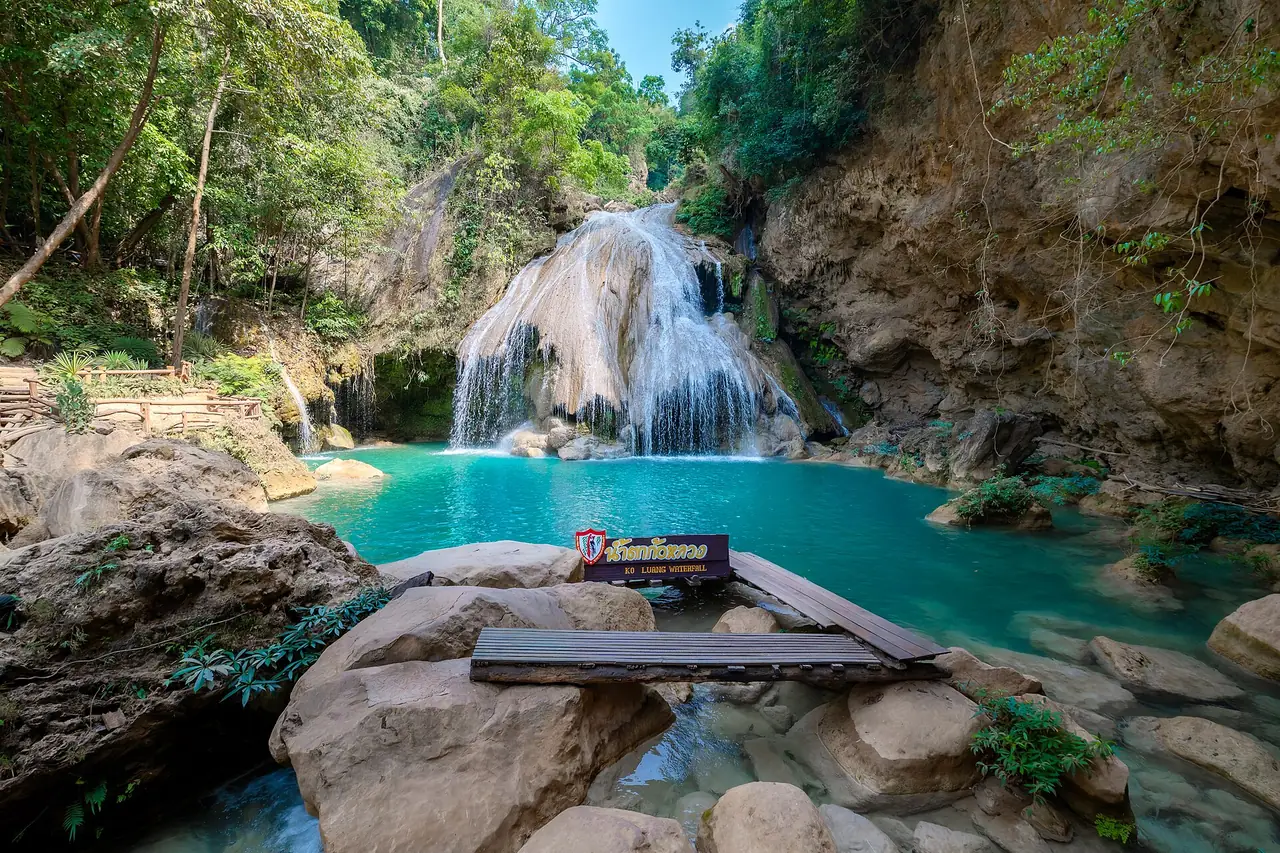 Ko Luang Waterfall in Li district, a limestone waterfall falling into a turquoise pool