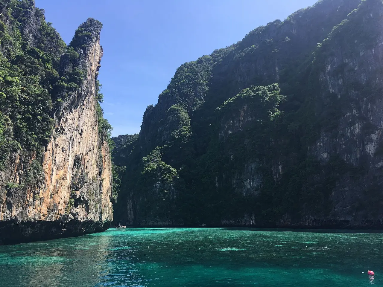 Pileh Lagoon on Phi Phi Leh, a sheltered green-water bay often visited on the same trip as Maya Bay.