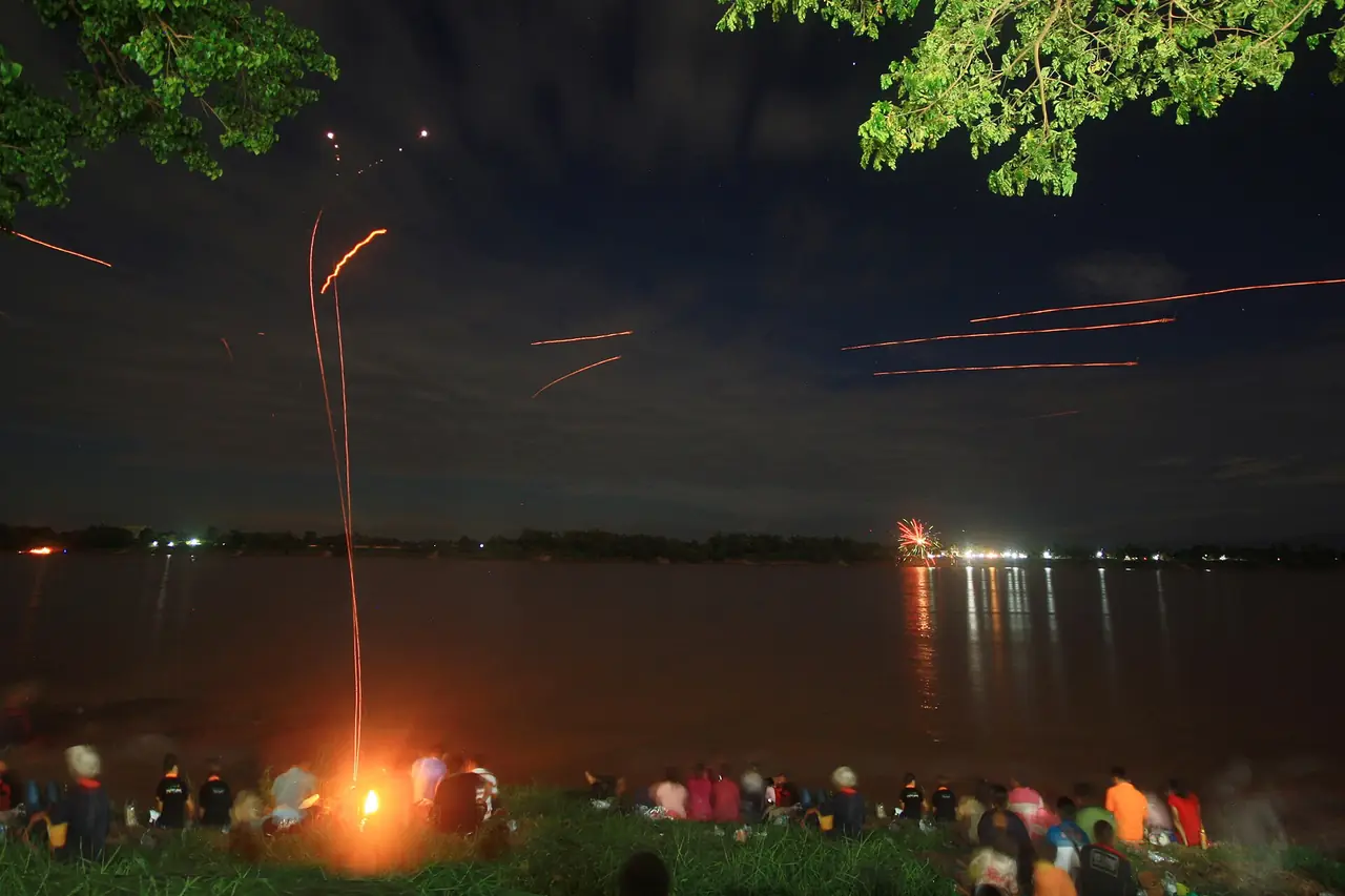 Red light trails over the Mekong on a Naga fireball night, in a Commons photo