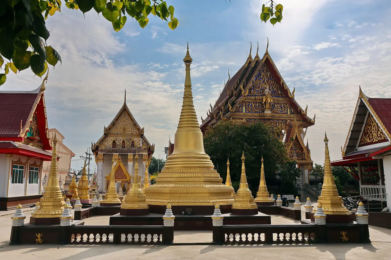 The golden chedi and ordination hall of Wat Samlae, a Mon temple on the Chao Phraya