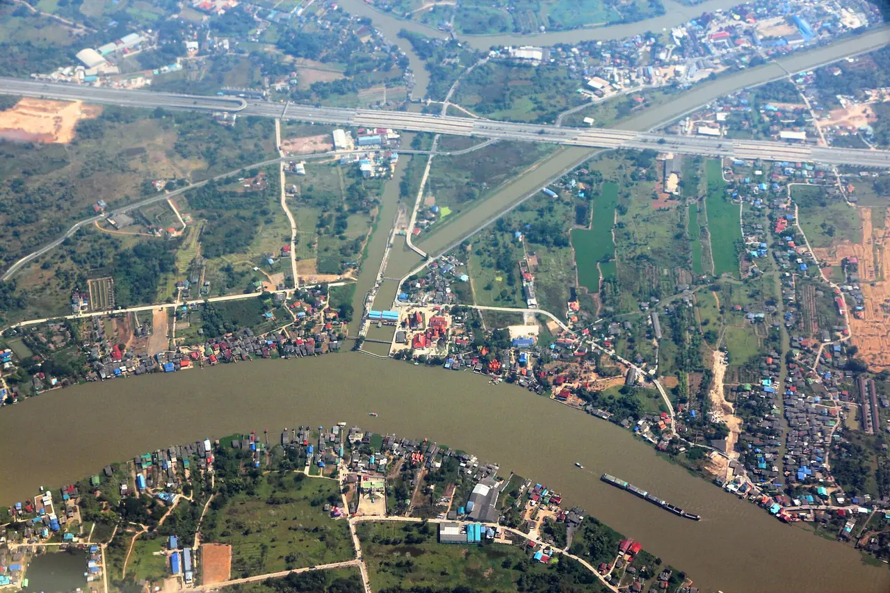 Aerial view of the Chao Phraya and a cargo barge in Pathum Thani province