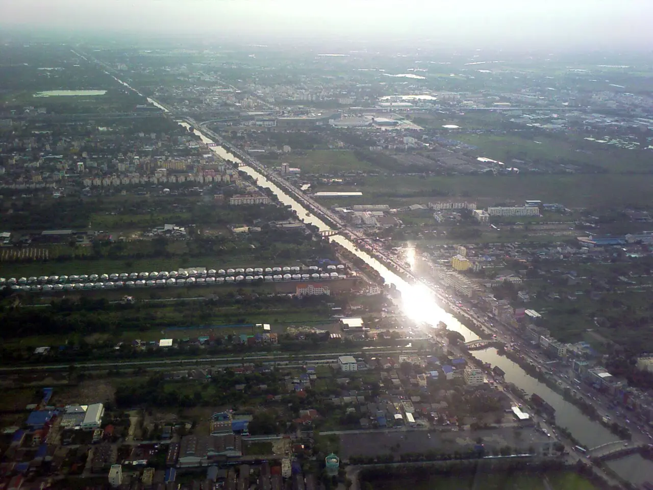 Aerial view of Khlong Rangsit, one of the first irrigation canals in Siam, running through the Thung Luang plain