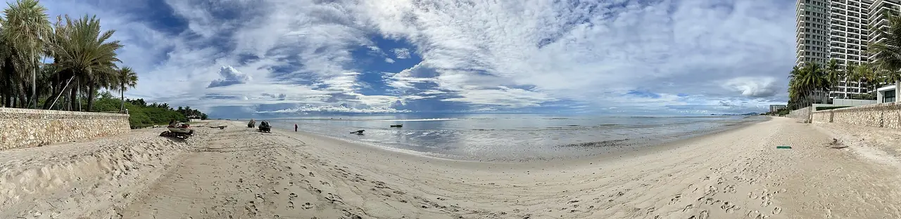 The long sandy beach at Cha-am on the Gulf of Thailand, in a panoramic photo