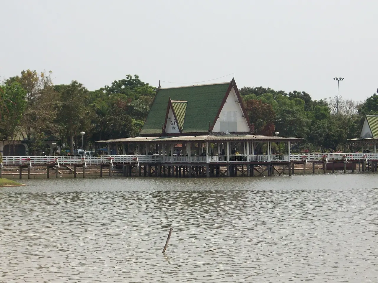 A lakeside pavilion reaching into the water; the Commons file is titled Marsh of Phichit