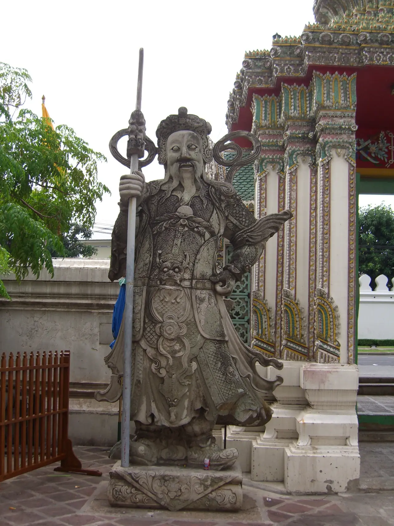 A Chinese stone guardian at a Wat Pho gate